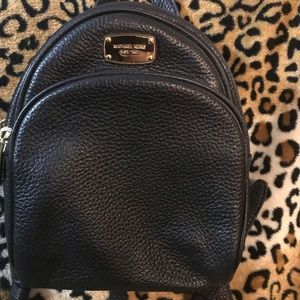 Small black pebbled Michael kors backpack